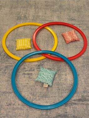 Lovevery 6-piece ring toss with matching colorful bean bags